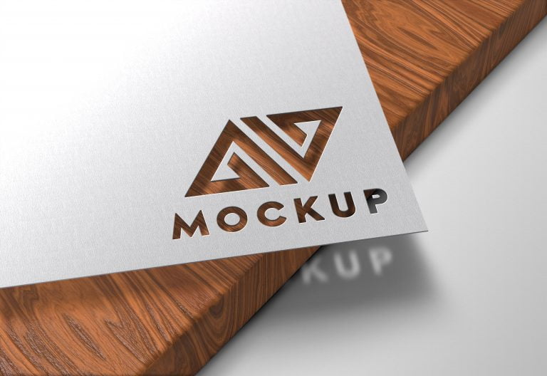 Paper Cutout on Wood Logo Mockup GraphicsFamily