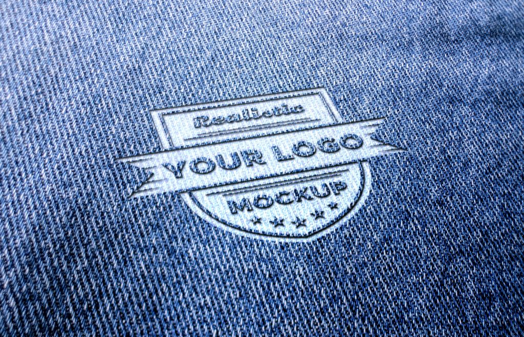 Realistic logo mockup on blue jeans or blue fabric – GraphicsFamily