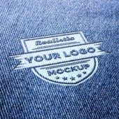 Realistic logo mockup on blue jeans or blue fabric