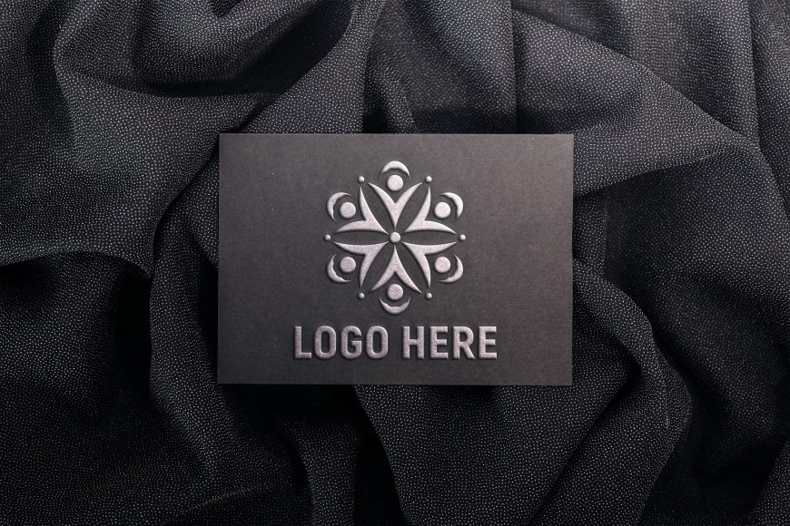 Embossed logo mockup on black paper