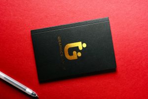 Gold Foil Logo Mockup on Black Book – GraphicsFamily
