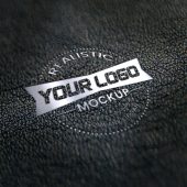 Realistic silver logo mockup on black leather