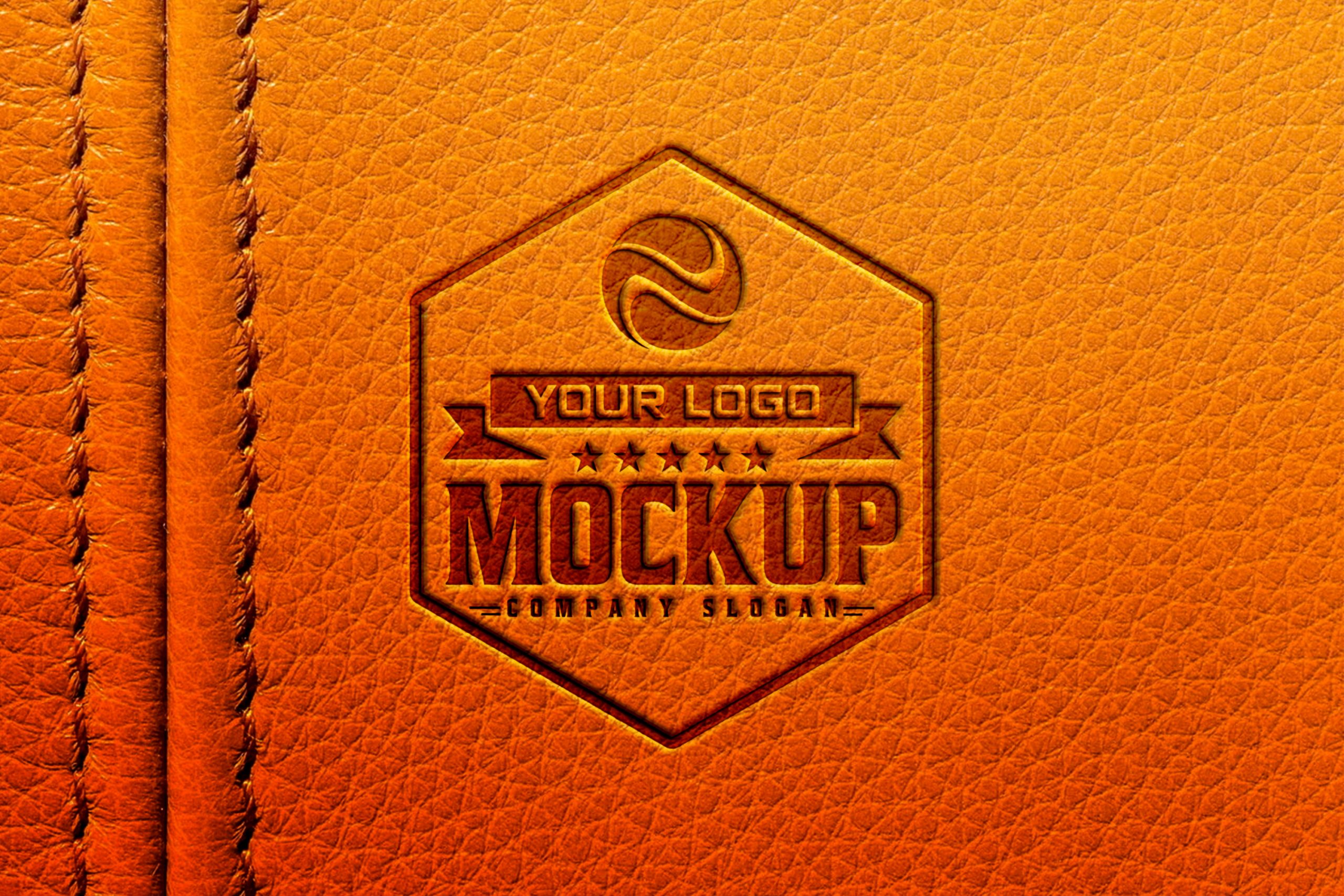 Dark Logo Mockup on Orange Leather Background – GraphicsFamily